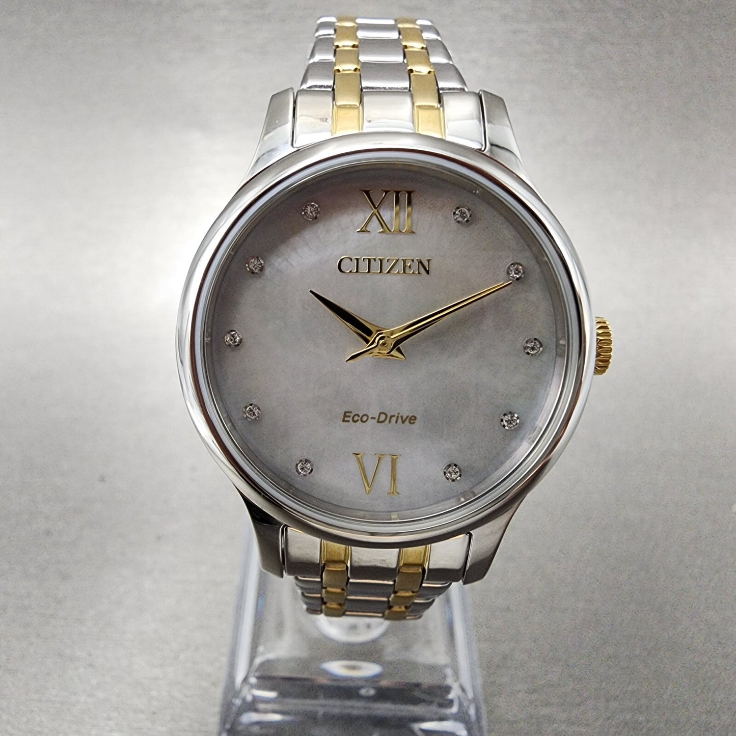 Citizen Eco-Drive Watch Women 31mm MOP Dial Two Tone Crystal Markers EM0894-50D