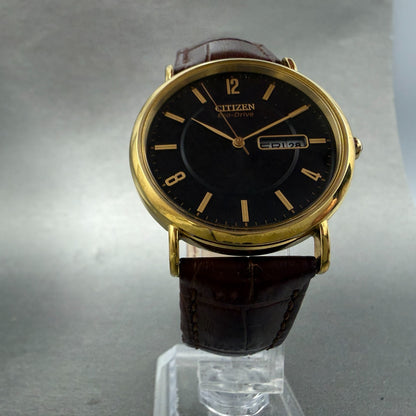 Citizen Eco-Drive Watch Men 36mm Black Dial Gold Tone Daydate E101-S015588 Runs5