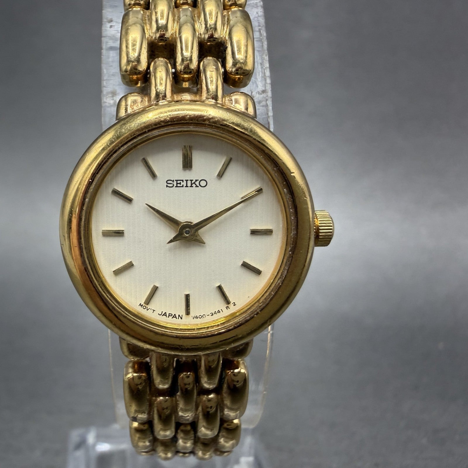 Seiko Watch Women 20mm White Dial Gold Tone Round V400-0990 New Battery ABC0
