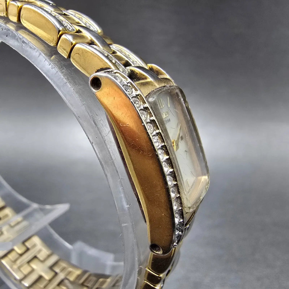 Citizen Eco-Drive Tank Watch Women 15mm White Dial Gold Tone Crystal Bezel Runs3