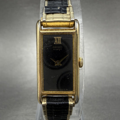 Seiko Tank Watch Women 13mm Black Dial Gold & Black Tone 2E20-5120 New Battery0