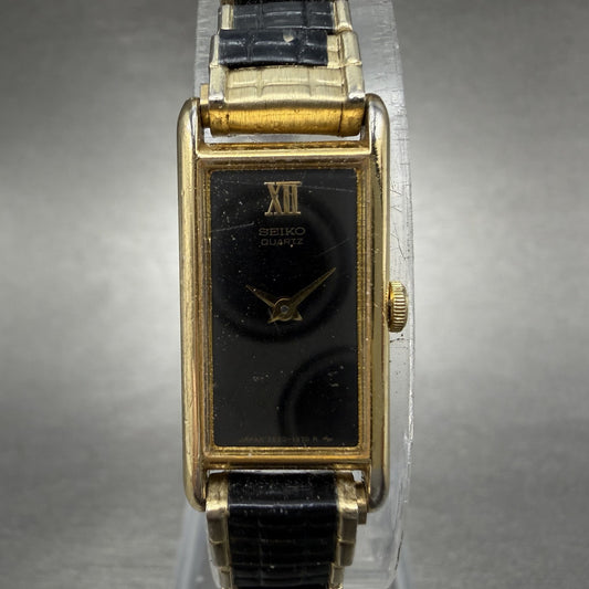 Seiko Tank Watch Women 13mm Black Dial Gold & Black Tone 2E20-5120 New Battery0