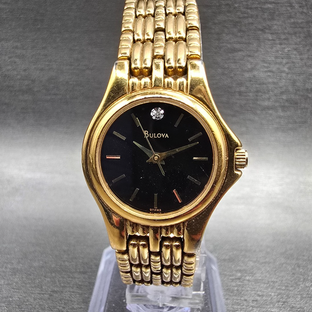 Bulova Watch Women 24mm Black Dial Gold Tone Round 97P43 New Battery0