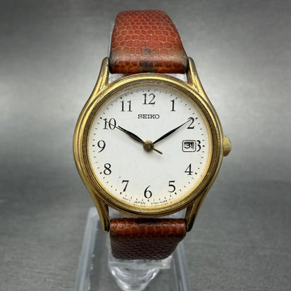 Seiko Watch Women 25mm White Dial Gold Tone Date Round V782-6E50 New Battery0