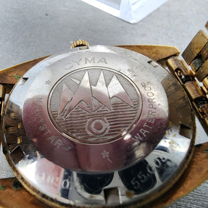 Cyma Navy Star Watch Men 35mm Brown Dial Gold Tone Date Automatic Cushion Runs