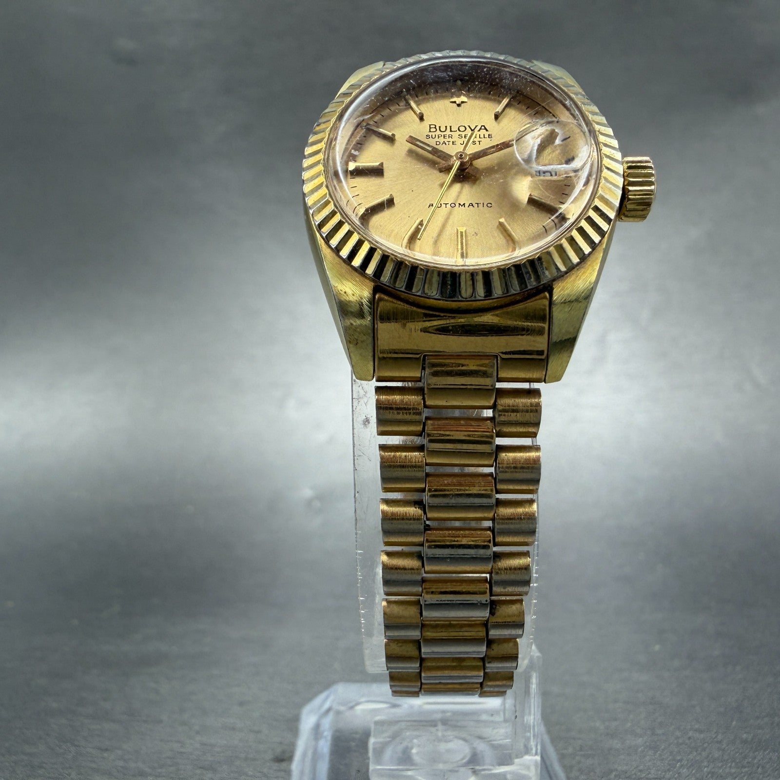 Bulova Super Seville Date Just Watch Women 26mm Gold Dial Gold Tone Automatic A15