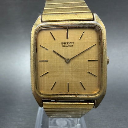Seiko tank Watch Men 26mm Champagne Dial Gold Tone Rectangle 7430-5309 New Batt0