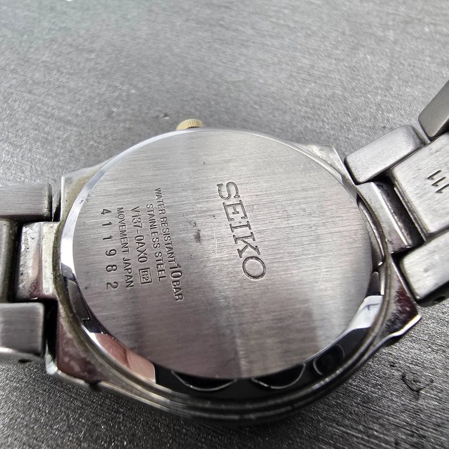 Seiko Solar Watch Women 30mm White Dial Two Tone Date Round V137-0AX0 Runs9