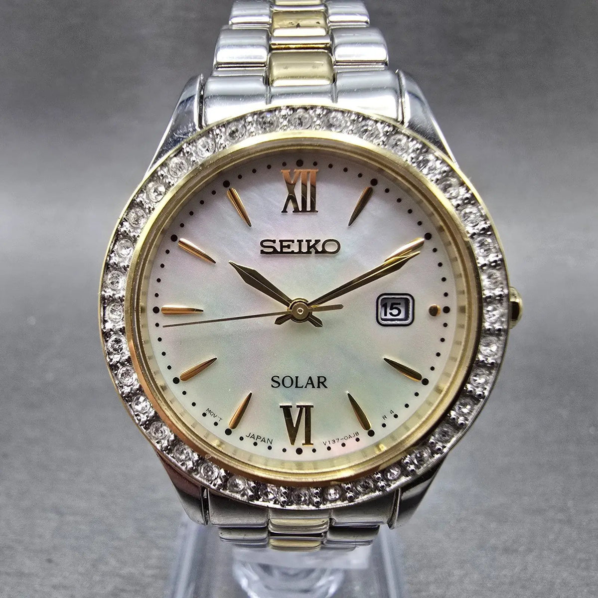 Seiko Solar Watch Women 28mm MOP Dial Two Tone Date Gemmed V137-0AA0 Works JP 670