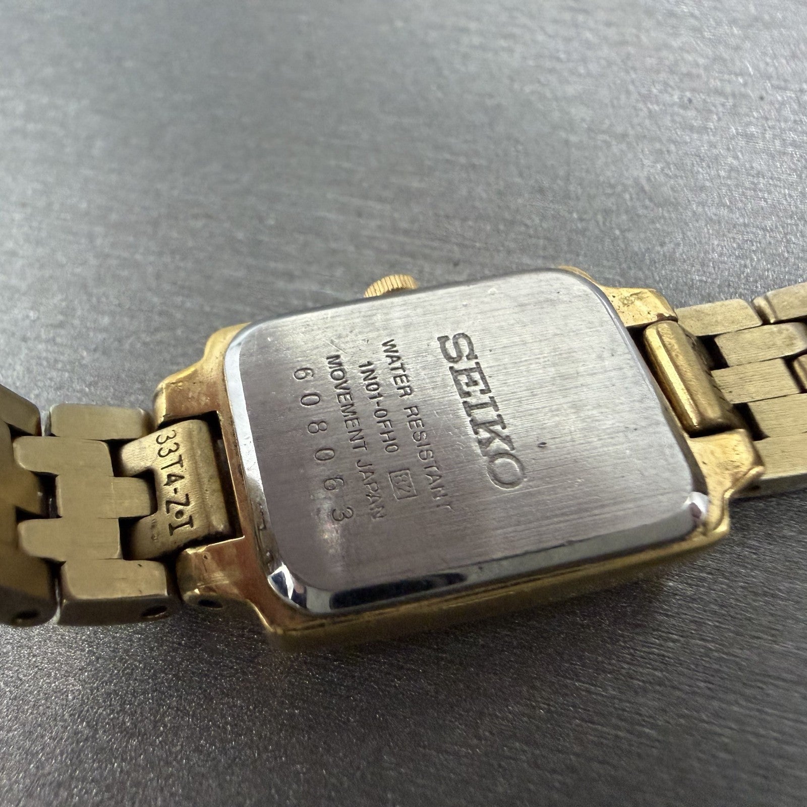 Seiko Tank Watch Women 16mm Champagne Dial Gold Tone 1N01-0FH0 New Battery ZYX29