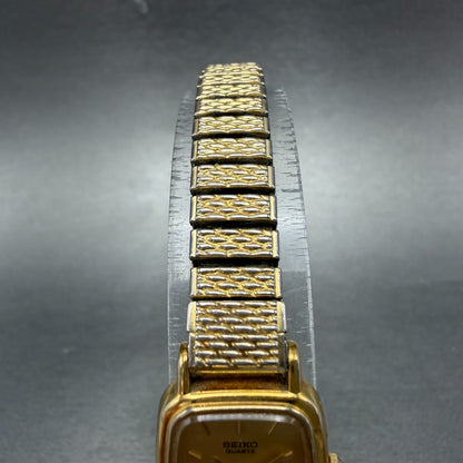 Seiko Watch Women 18mm Champagne Dial Gold Tone Rectangle 1N00-5K29 New Battery54