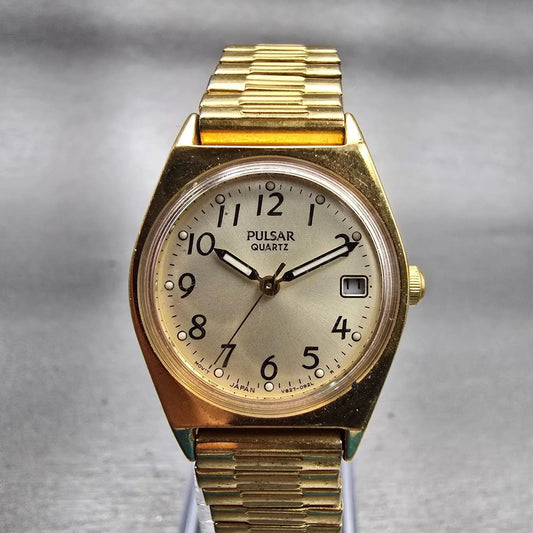 Seiko Pulsar Watch Women 23mm Champagne Dial Gold Tone Date V827-0430 New Batt0