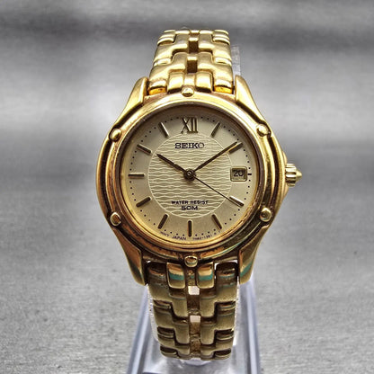 Seiko Watch Women 26mm Champagne Dial Gold Tone Date Round 7N82-0599 New Battery0