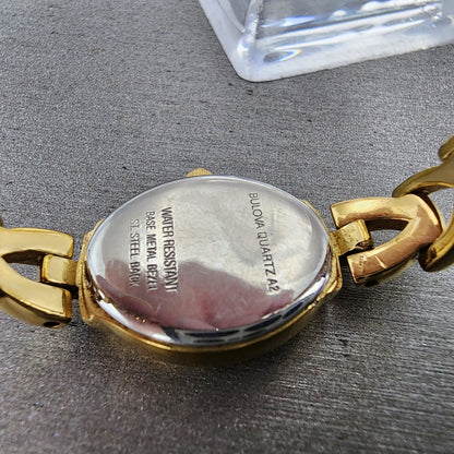 Bulova Watch Women 17mm White Dial Gold Tone Oval 97T70 New Battery9