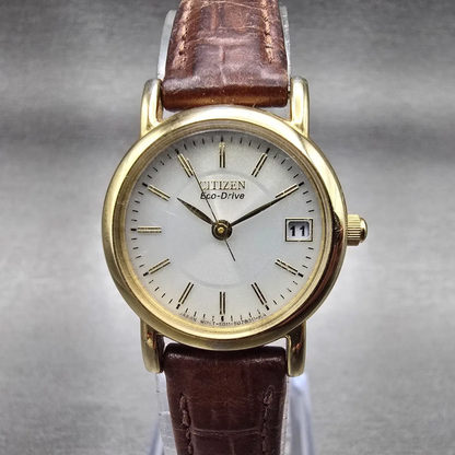 Citizen Eco-Drive Watch Women 23mm Silver Dial Gold Tone Date E011-S049423 Works0