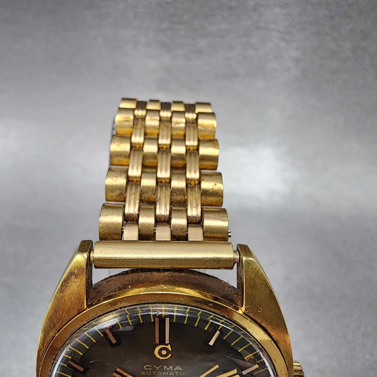 Cyma Navy Star Watch Men 35mm Brown Dial Gold Tone Date Automatic Cushion Runs