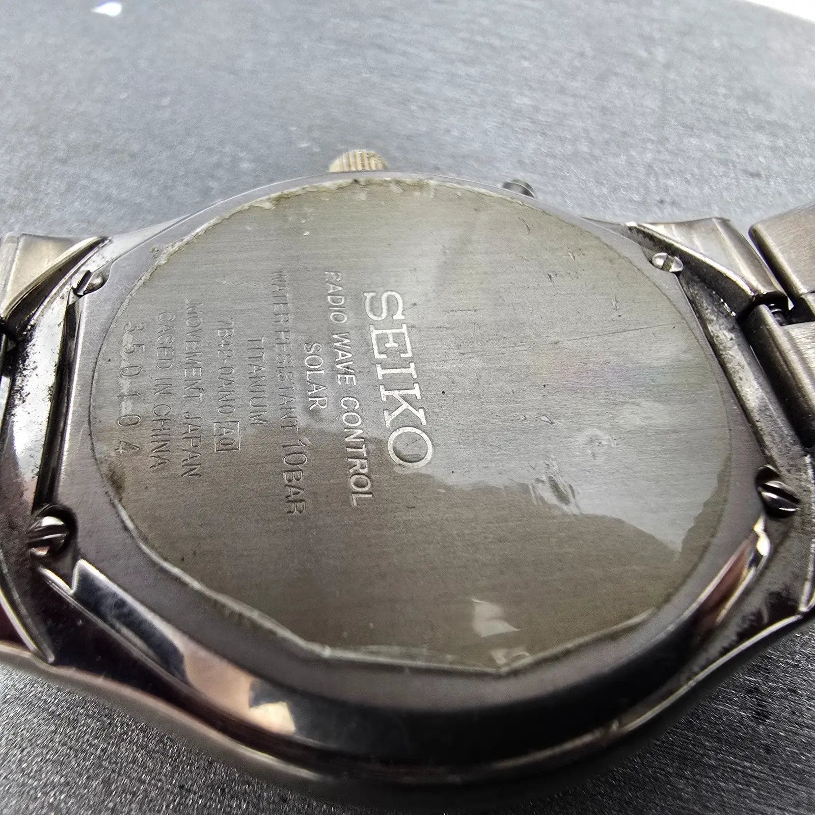 Seiko Atomic Solar Watch Men 39mm White Dial Titanium Date 7B42-0AN0 PARTS GYVJ10