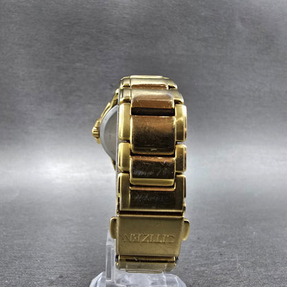 Citizen Eco-Drive Watch Women 30mm Silver Dial Gold Tone Date E013-S111676 Runs7
