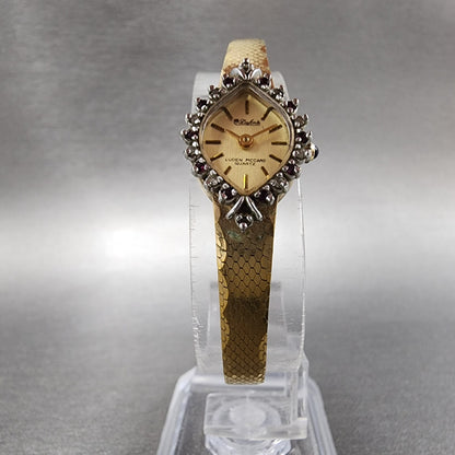 Lucien Piccard Dufonte Watch Women 14mm Champagne Dial Gold Tone Ruby Bezel Runs