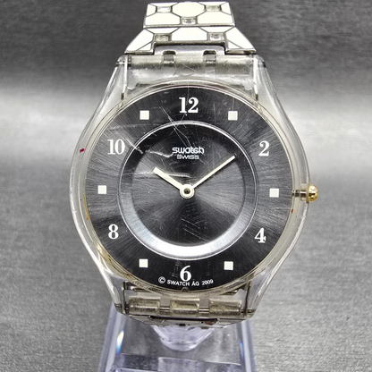 Swatch Elegantly Framed Watch Women 34mm Silver Dial Clear Case SFK356G New Batt0