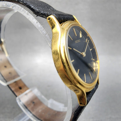 Seiko Watch Women 26mm Black Dial Gold Tone Round V7006091 New Battery B12343