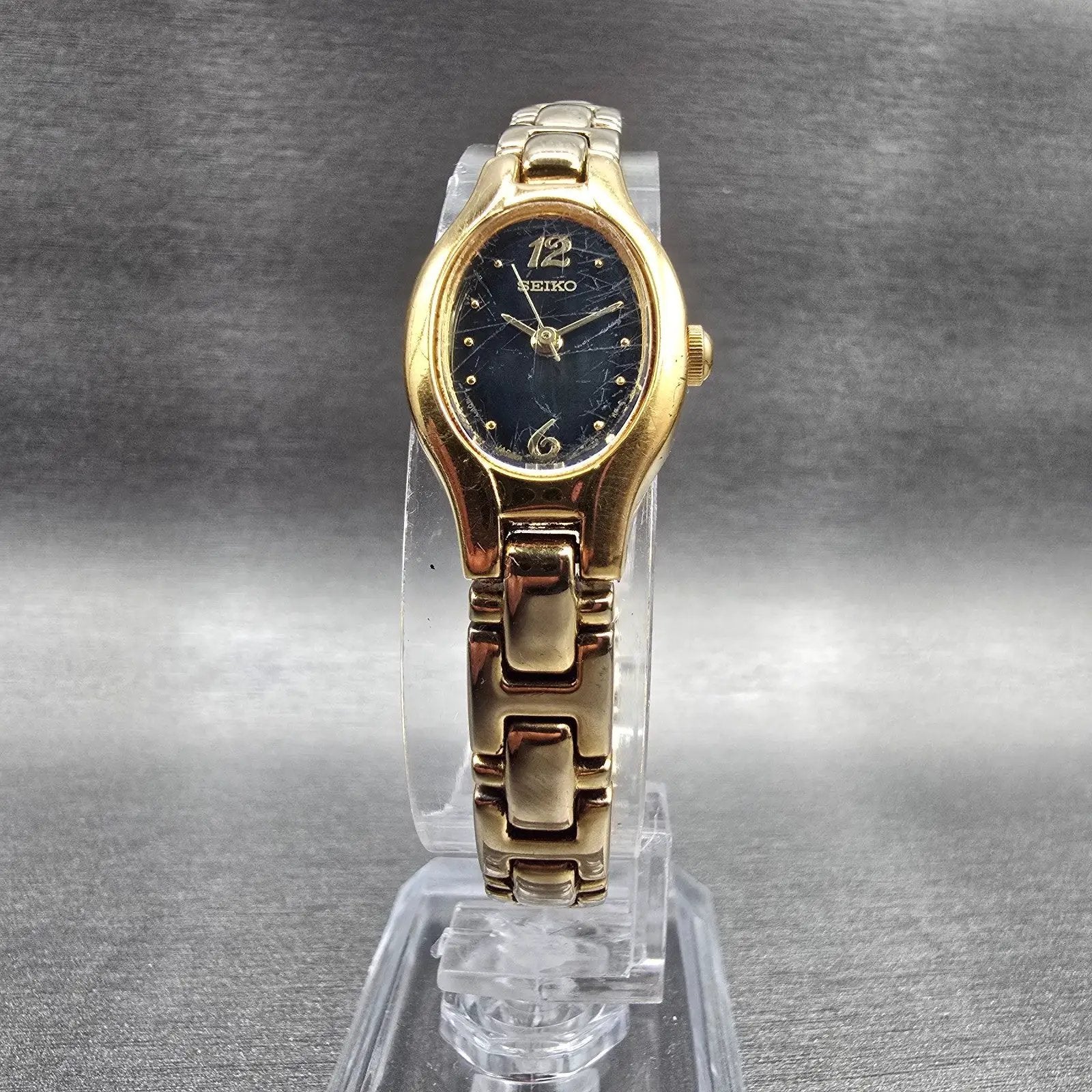 Seiko Watch Women 16mm Black Dial Gold Tone Oval 1N01-0CS0 New Battery Vintage D5