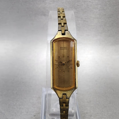 Seiko Watch Women 12mm Champagne Dial Gold Tone Rectangle 2E205179 New Battery0