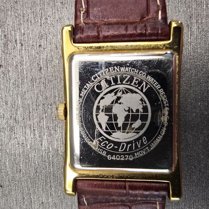 Citizen Eco-Drive Tank Watch Men 25mm Ivory Dial Gold Date E010-S001579 Works10