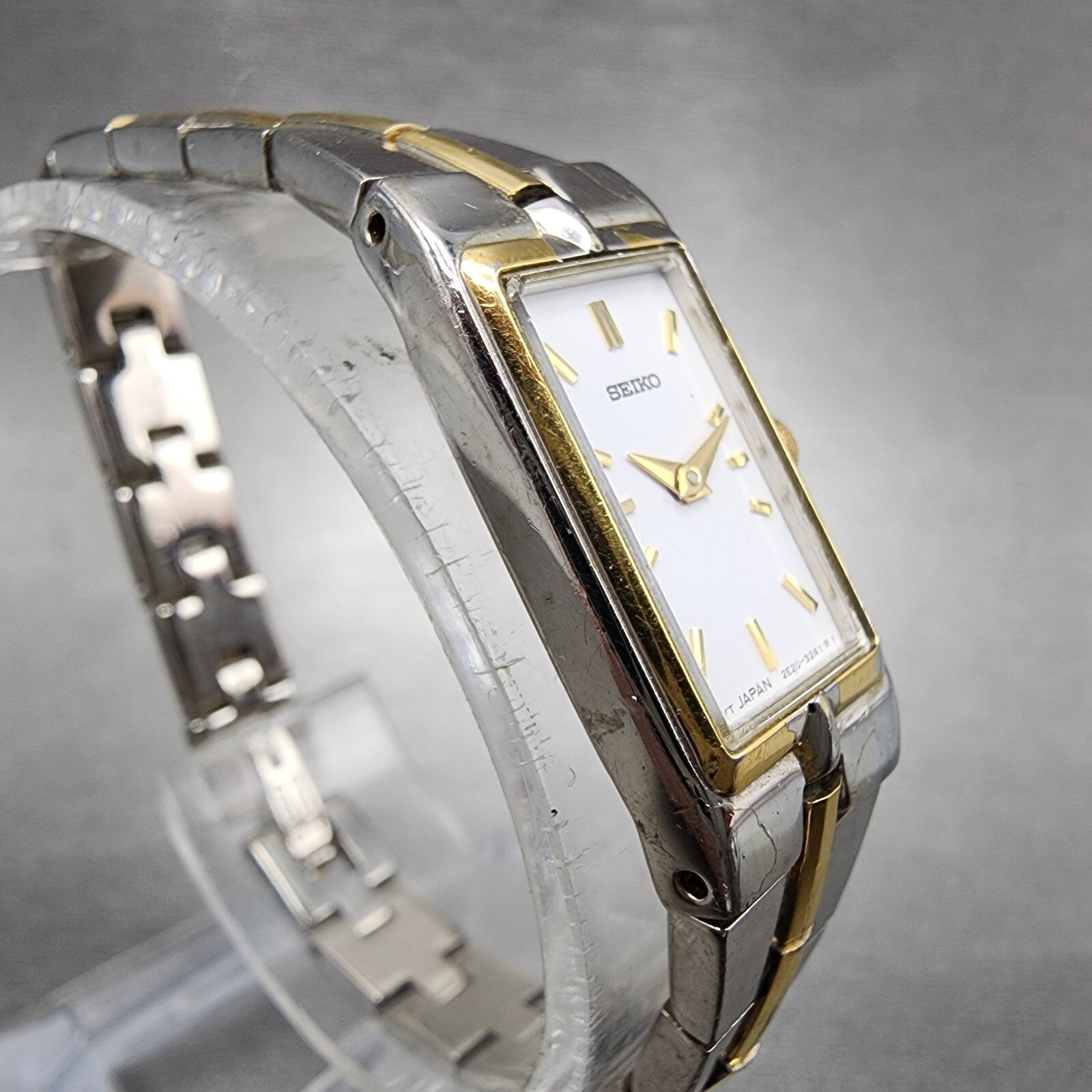 Seiko Watch Women 13mm White Dial Two Tone Rectangle 2E207479 New Battery C5673