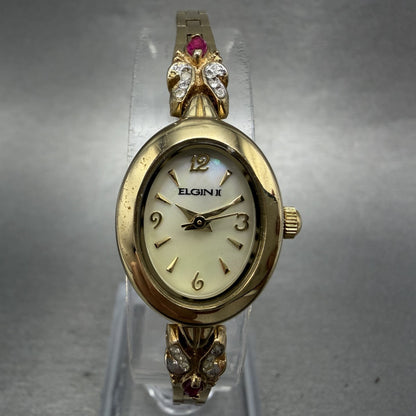 Elgin Watch Women 18mm MOP Dial Gold Tone Oval Ruby Diamond Bezel New Battery0