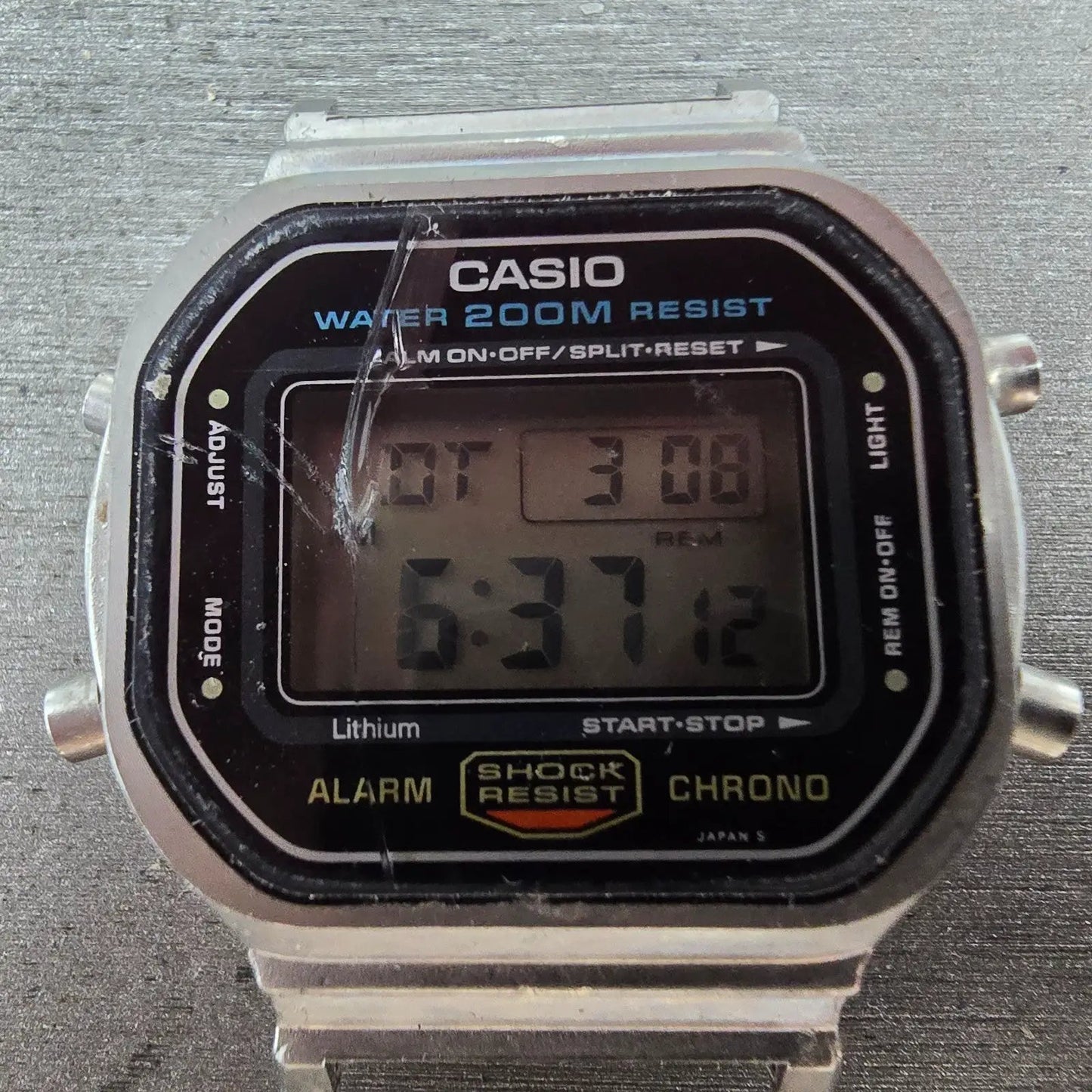 Casio DW-5600 Watch Men 38mm Silver Digital Alarm Chrono 691 New Battery CRACKED1
