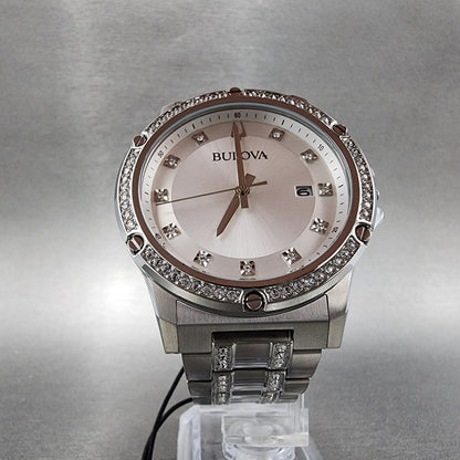 Bulova women's silver-tone watch with crystal accents and date display on a metallic band