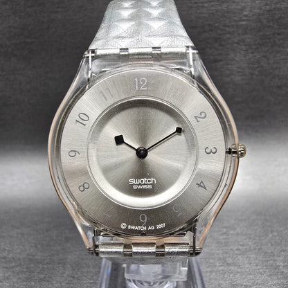 Swatch Skin Facet Glam Watch Women 34mm Silver Dial Clear Case SFK312 New Batt1