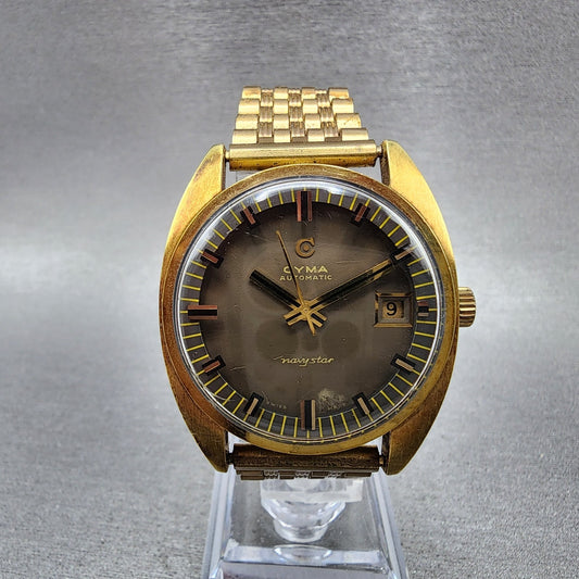 Cyma Navy Star Watch Men 35mm Brown Dial Gold Tone Date Automatic Cushion Runs