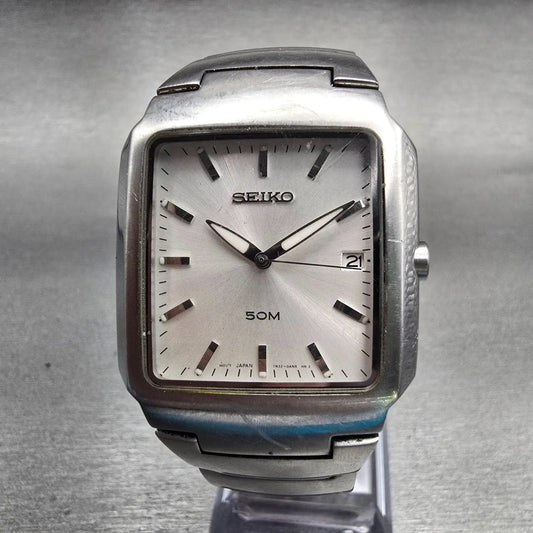 Seiko Watch Men 32mm Silver Dial Silver Tone Date Rectangle 7N32-0AL0 New Batt D0
