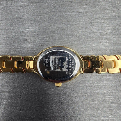 Bulova Watch Women 17mm White Dial Gold Tone Oval Gemmed 97V23 New Battery10