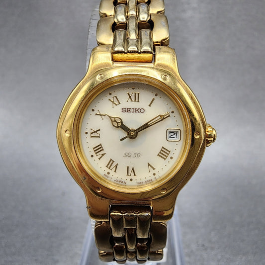 Seiko SQ 50 Watch Women 25mm White Dial Gold Tone Date Round 7N826C53 New Batt0