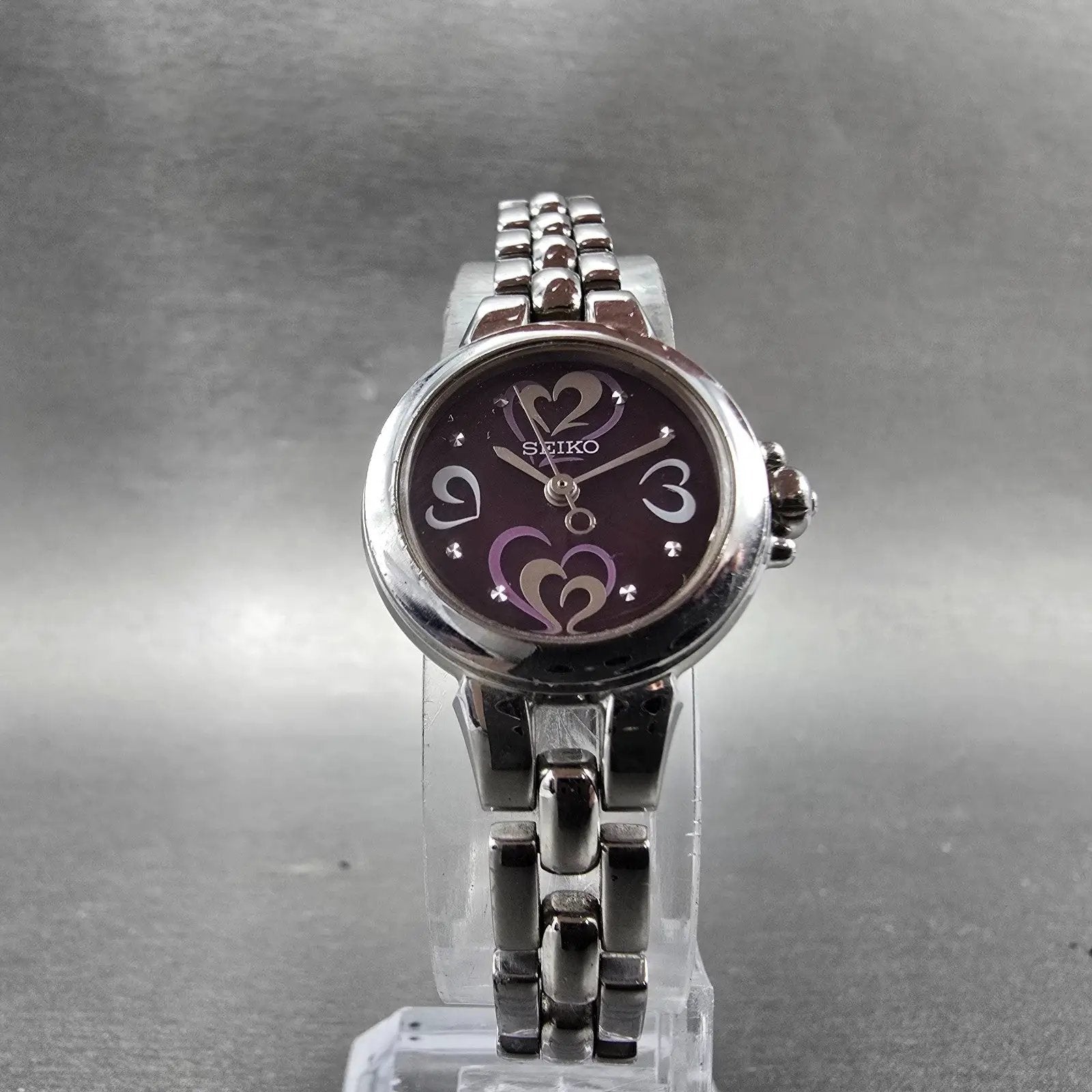 Seiko Solar Heart Watch Women 22mm Purple Dial Silver Tone Round V117-0BB0 Runs5