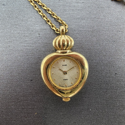 Alba Heart Necklace Watch Women 20mm Champagne Dial Gold Tone Y150-0B20 New Batt