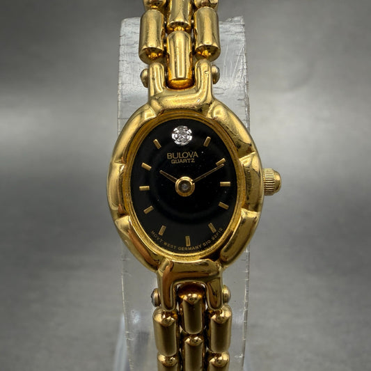 Bulova Watch Women 16mm Black Dial Gold Tone Oval 92F12 New Battery Diamond0