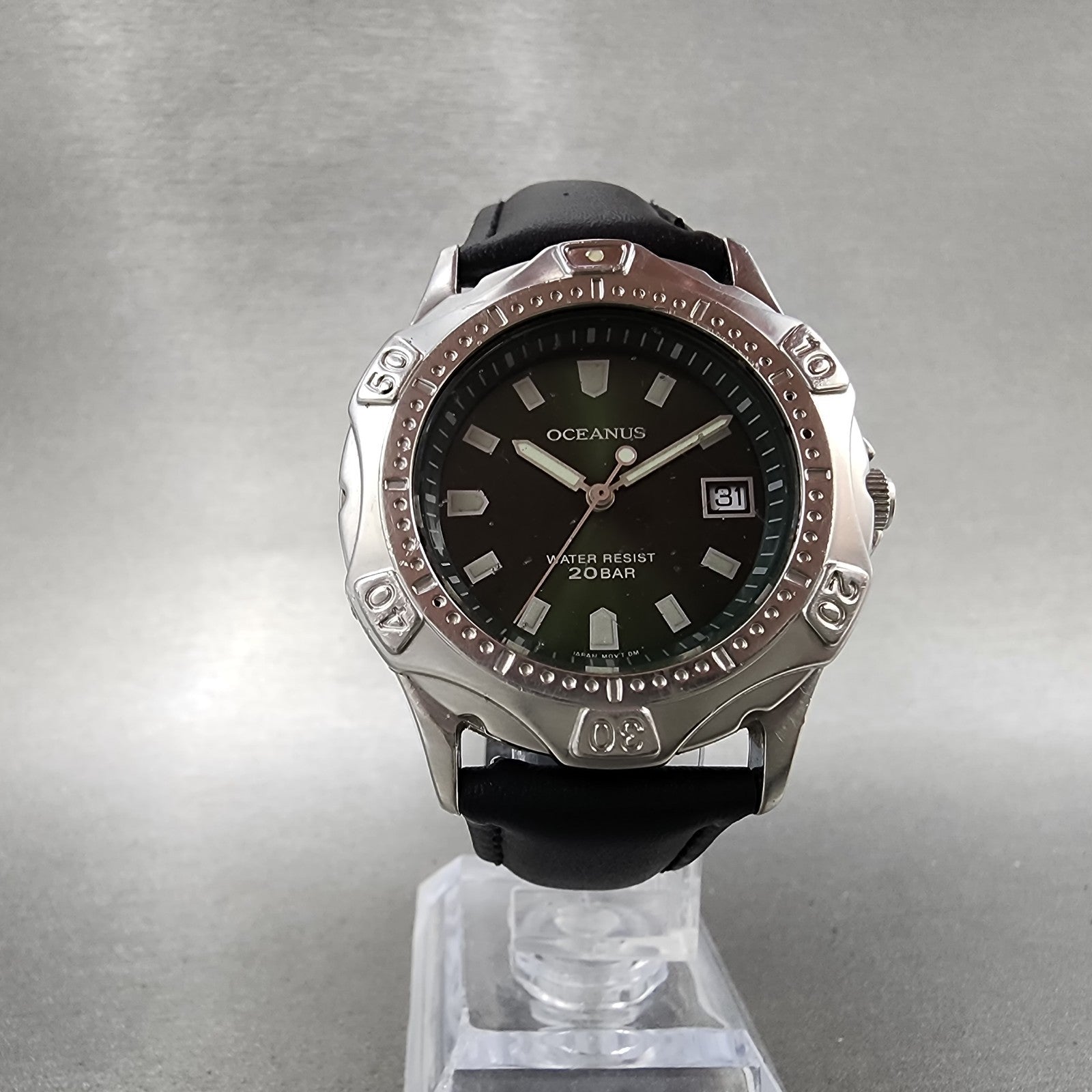 Oceanus 20BAR water resistant analog wristwatch with black dial and silver bezel on display