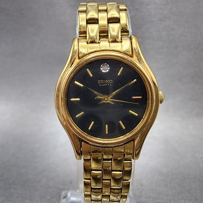 Seiko watch Women 24mm Black Dial Gold Tone Round V4011600 New Battery0