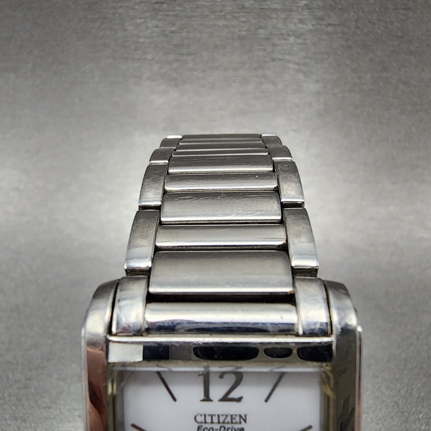 Citizen EcoDrive Tank Watch Women 26mm White Dial Silver Tone Date Runs4
