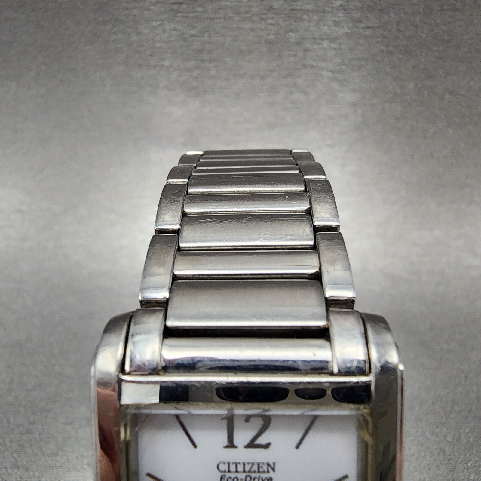 Citizen EcoDrive Tank Watch Women 26mm White Dial Silver Tone Date Runs4