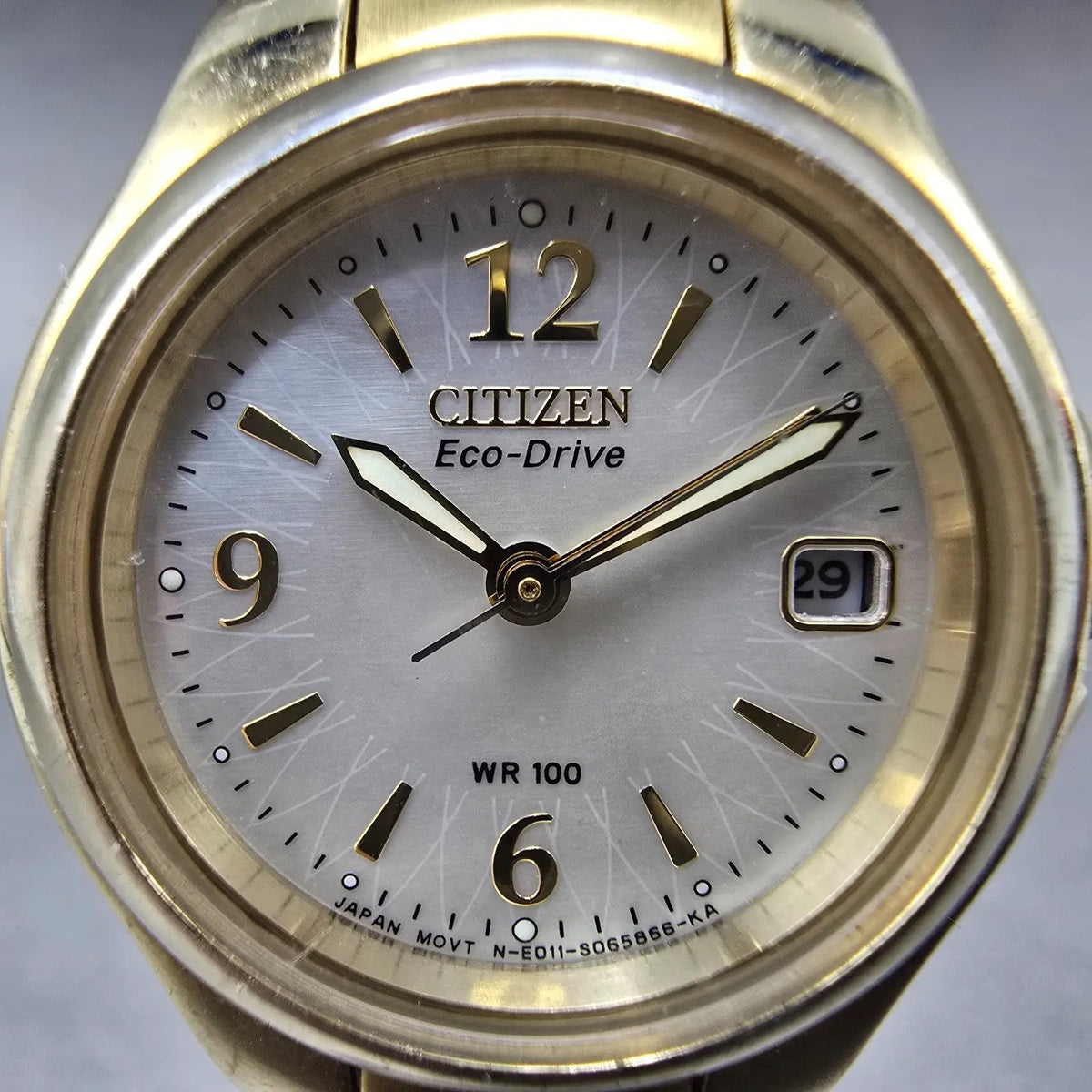 Citizen Eco-Drive Watch Women 25mm MOP Dial Gold Date E011-S039959 Round Works1