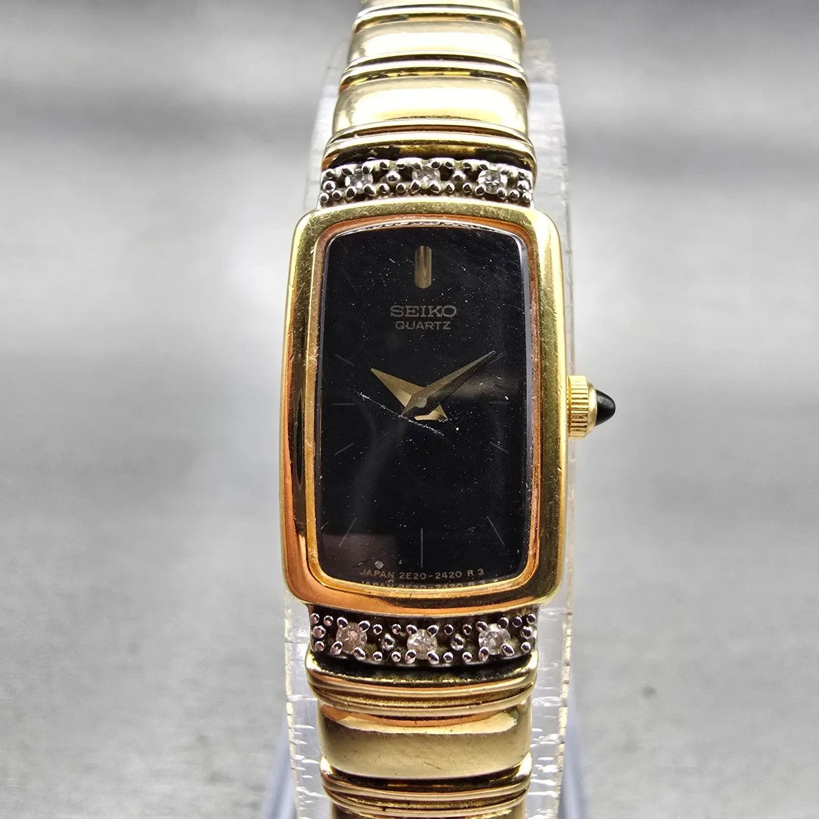 Seiko Watch Women 13mm Black Dial Gold Tone Gemmed Rectangle 2E20-6929 New Batt0