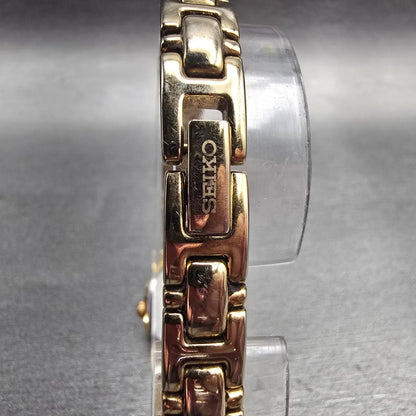 Seiko Watch Women 16mm Black Dial Gold Tone Oval 1N01-0CS0 New Battery Vintage D7