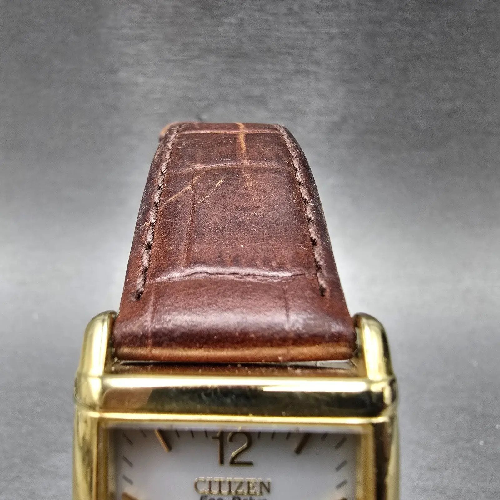 Citizen Eco-Drive Tank Watch Men 25mm White Dial Gold Date E010-S001579 Works HG4