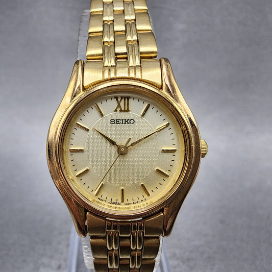 Seiko watch Women 24mm Champagne Dial Gold Tone Round V4011600 New Battery0