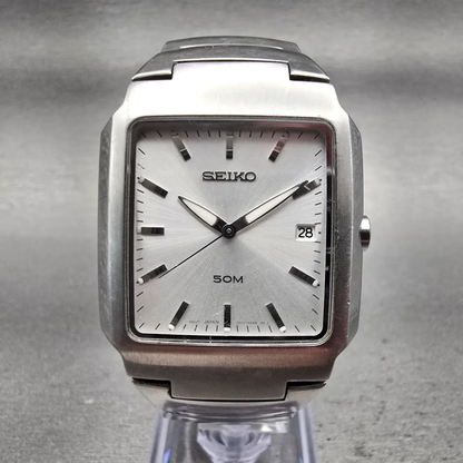Seiko Watch Men 32mm Silver Dial Silver Tone Date Rectangle 7N32-0AL0 New Batt0